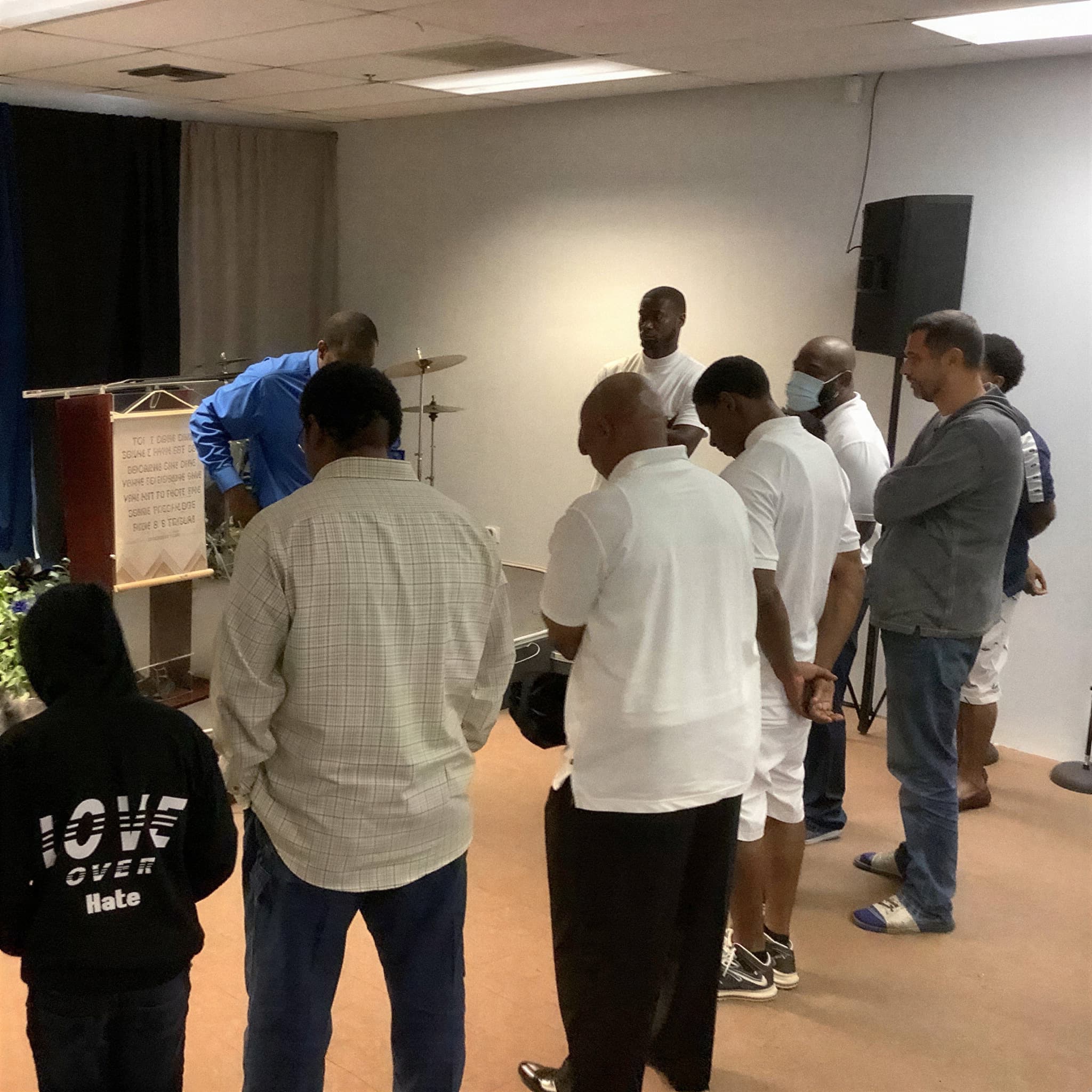 Men of See His Face Ministries gathered together at the front of the sanctuary